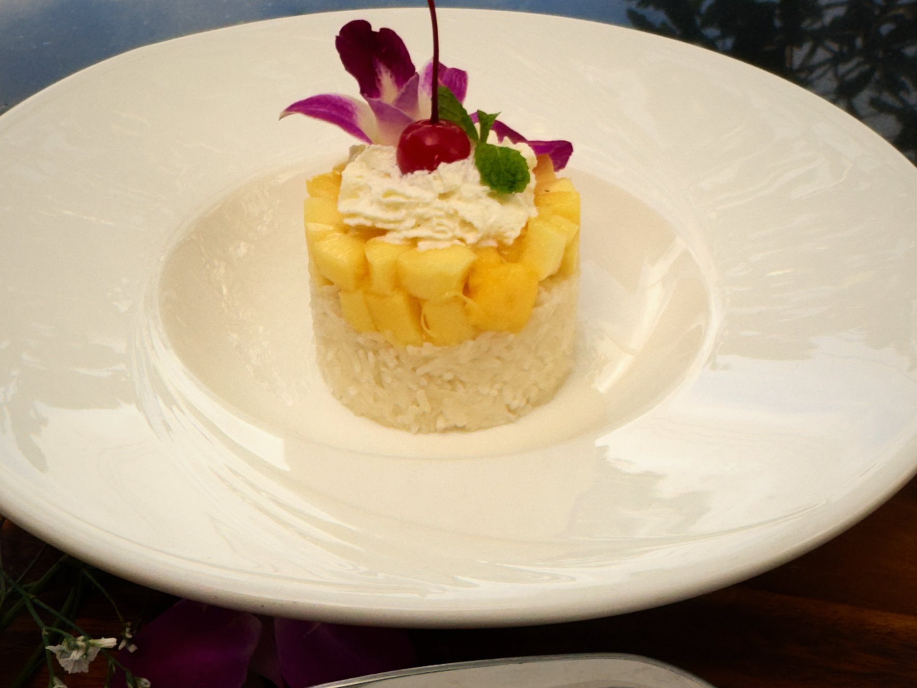 Khao niew mamuang: a ring of coconut sticky rice under diced mango and an orchid, RICE Bar + Restaurant, Patong